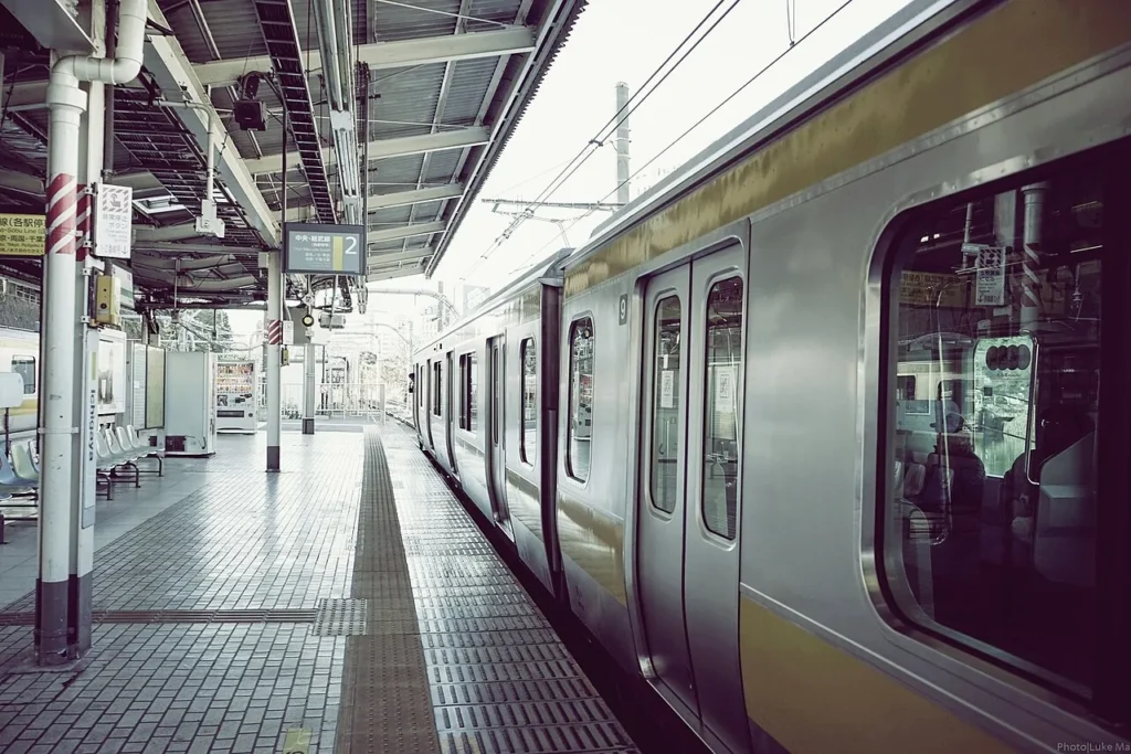 A commuter train next to the platform at Ichigaya Station, Tokyo